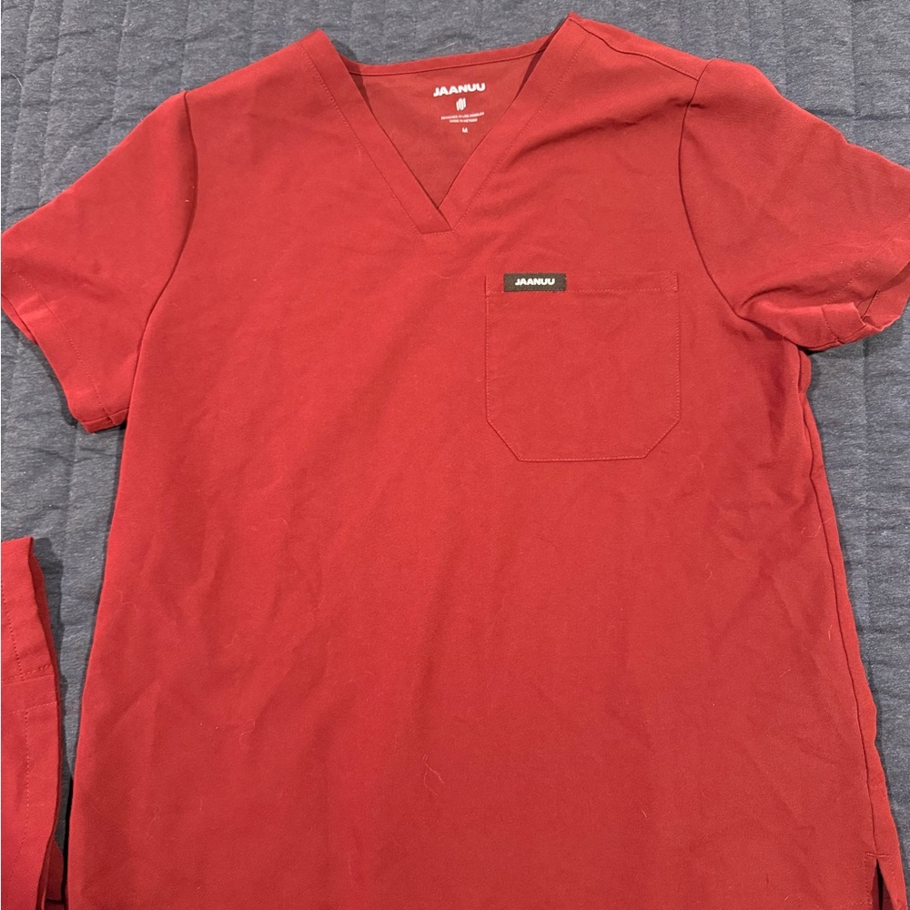 JAANUU Women’s Rhena Slim Essential 1-Pocket Scrub Top- Burgandy